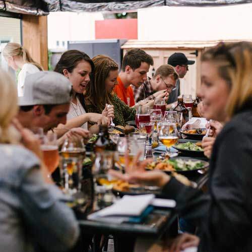 Diners enjoying a meal with excellent restaurant reviews.