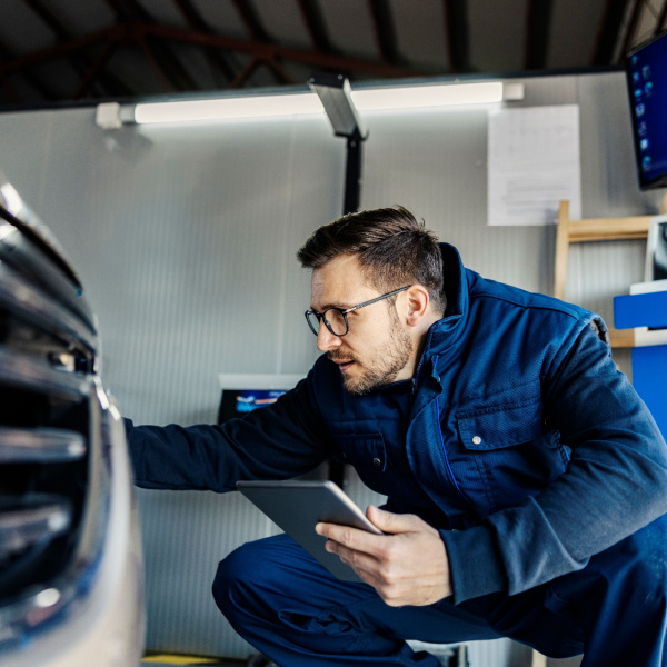 Professional reviewing a job checklist and next steps