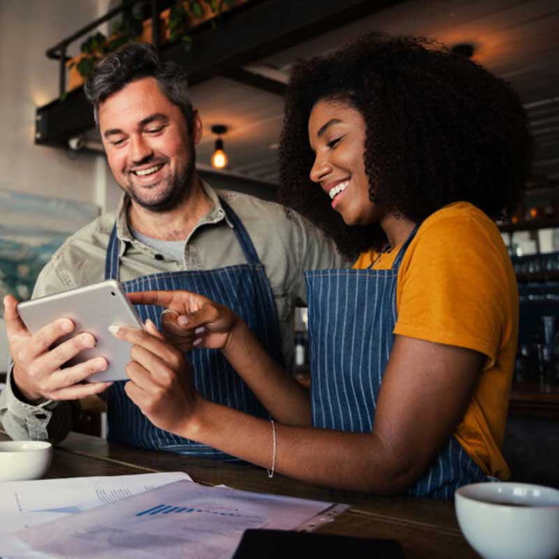 Restaurant owner reviewing marketing performance data