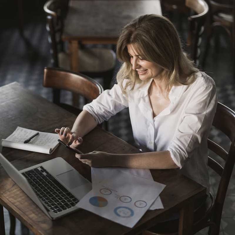 Restaurant owner reviewing marketing performance data to improve diner acquisition