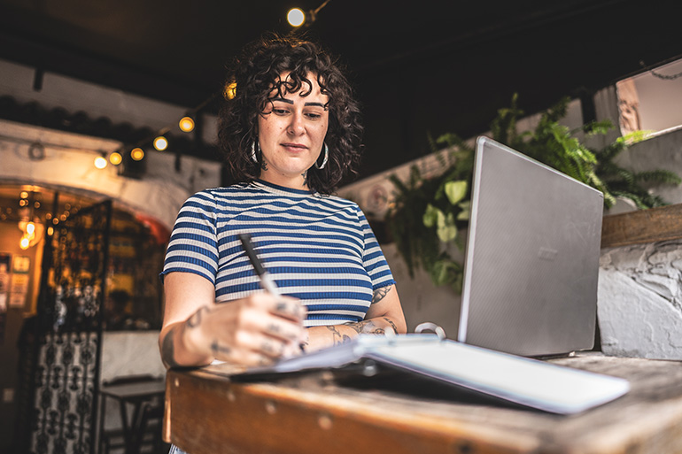 Restaurant owner reviewing marketing performance data and diner behavior