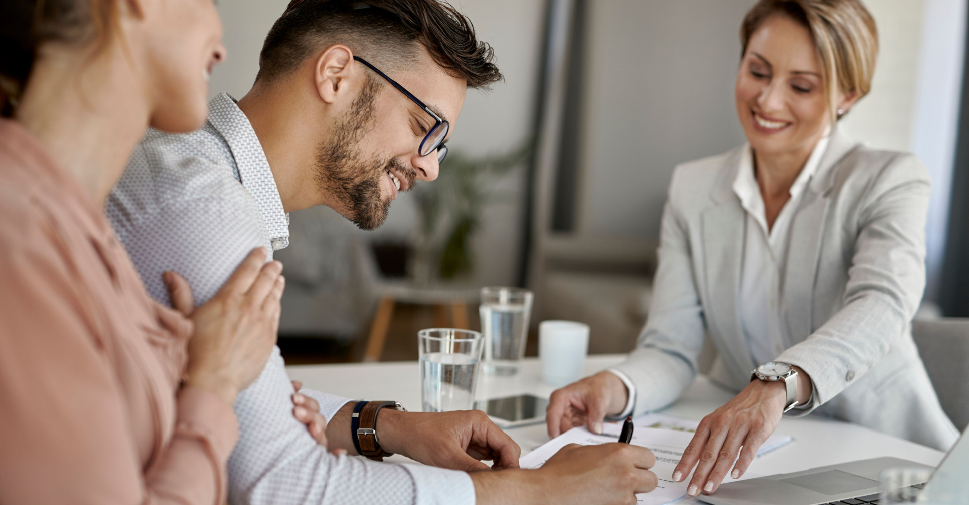 Real estate agent guiding clients through strategic home purchase decision